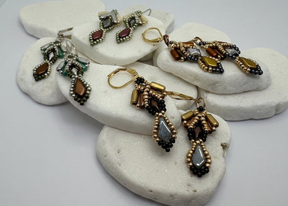 Set of earrings displayed on a white stone surface